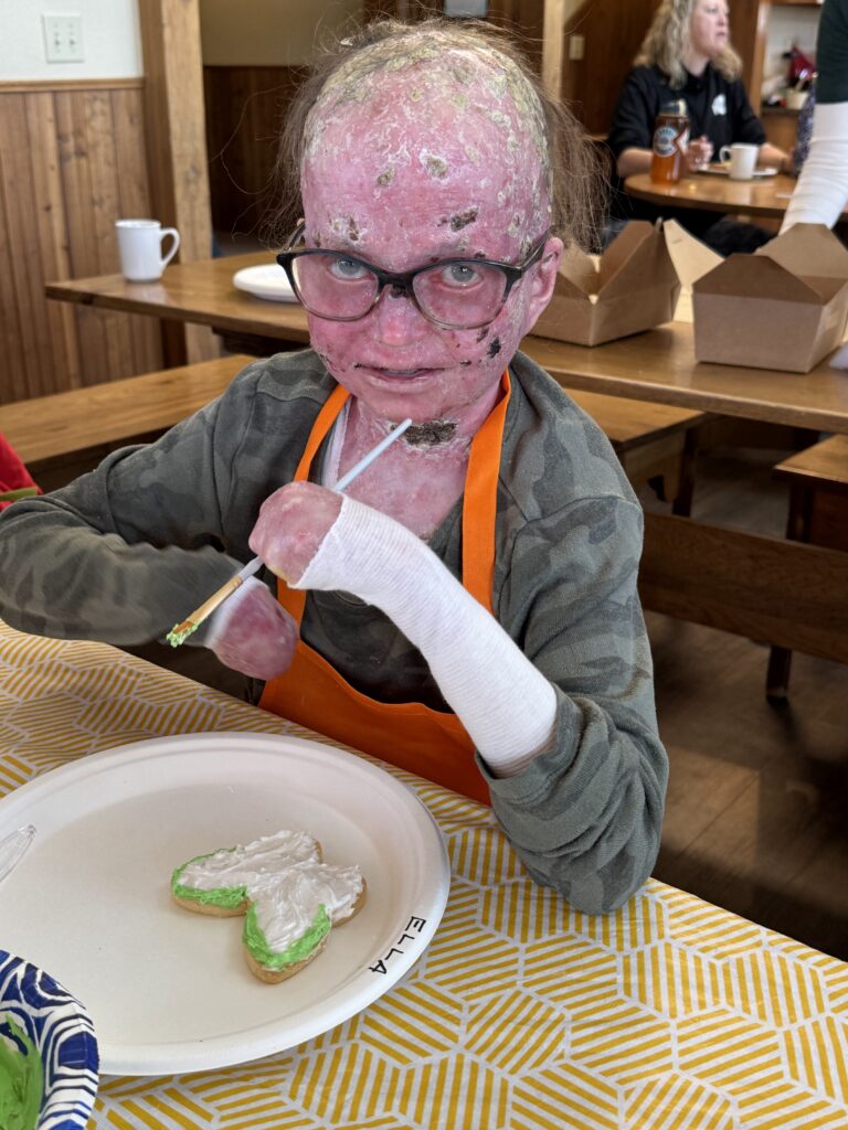 Ella decorating cookies