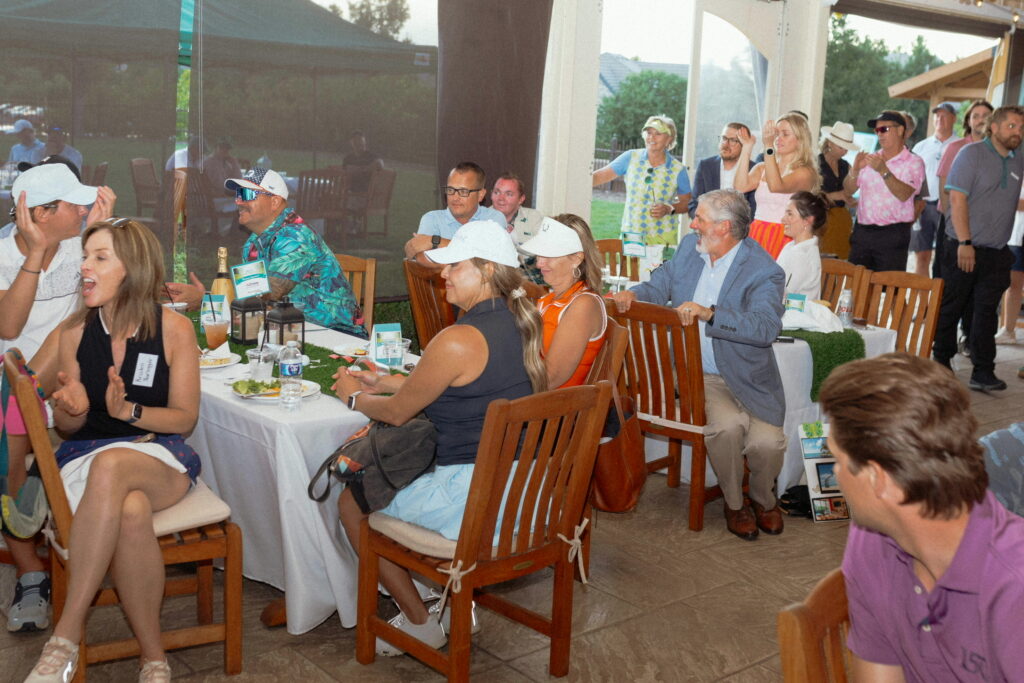 Vanessa McClanahan with back to camera and Dawn Tieken in the visor