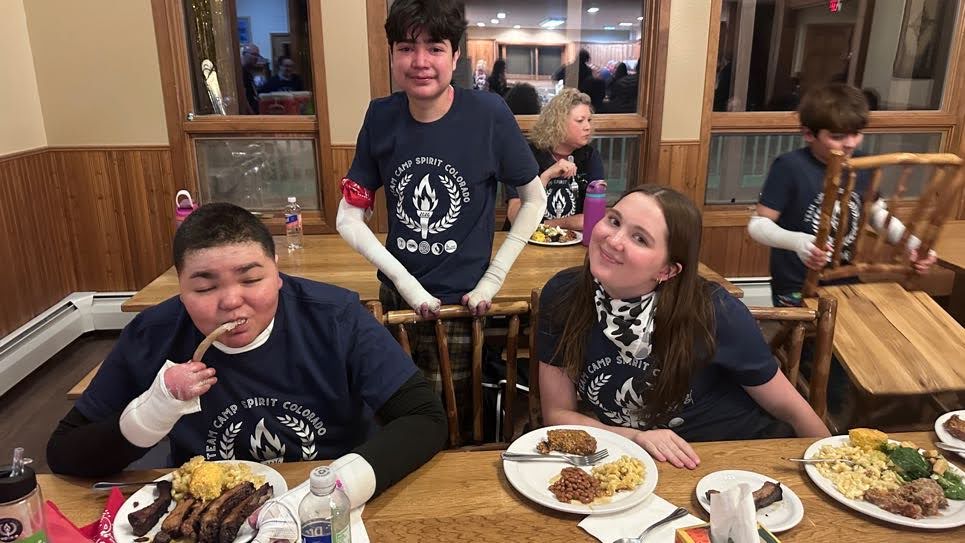 Avery, Darren and X eating ribs